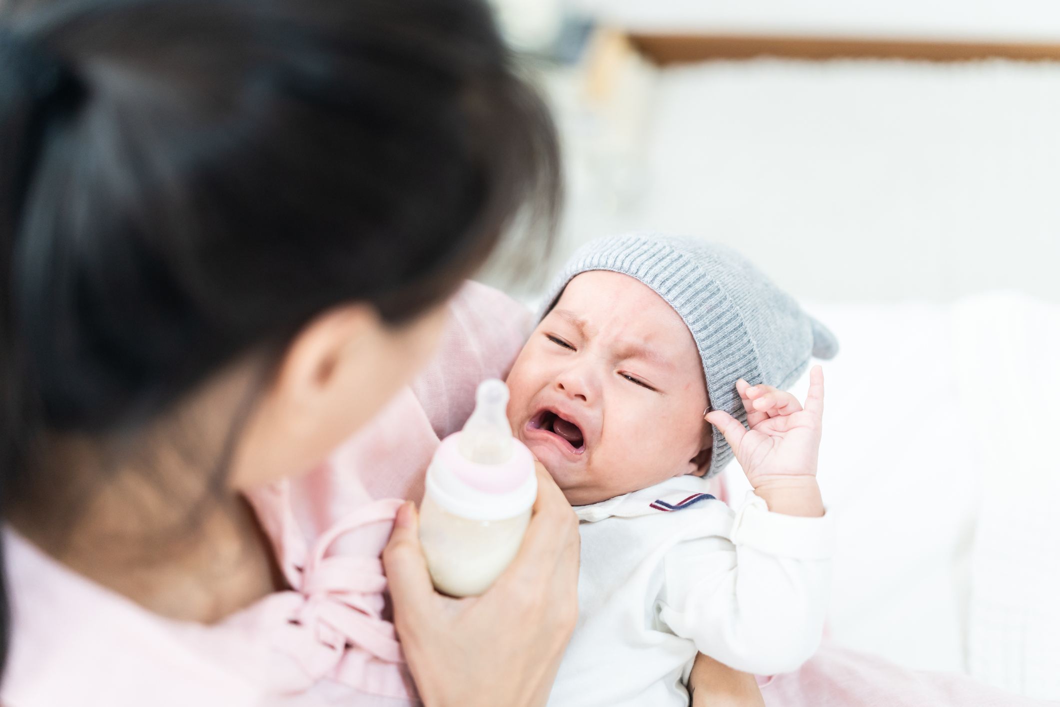Soothe a Baby Crying While Bottle Feeding
