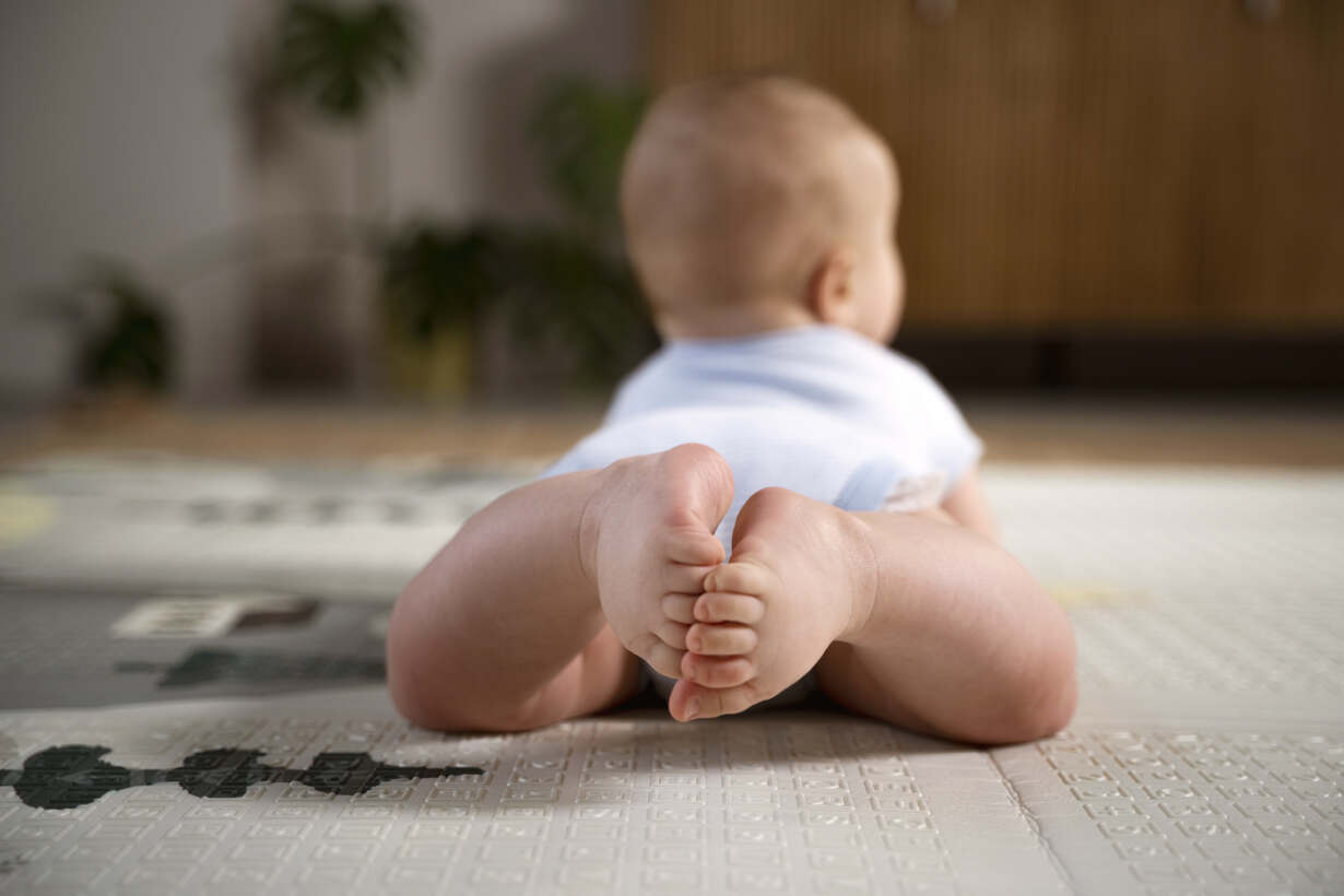 Baby Looking Between Legs of Responding to Curiosity